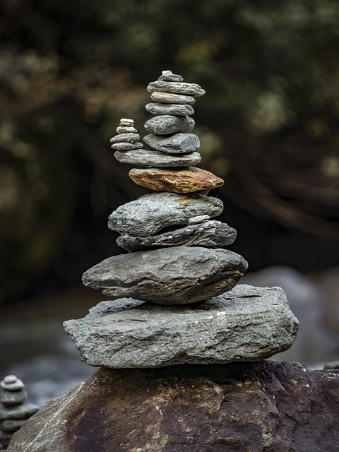 Stacked river stones symbolizing balance, boundaries, and clarity for art journaling disclaimer, in terms and policies linked section. stone tower, balance, meditation, stones, relaxation, zen, quiet, tower, meditate, patience, stack, stacked, layered, spiritual, cairn, silence, harmony, stone balance.