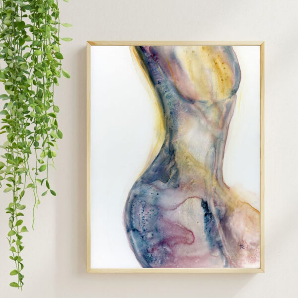 Original watercolor figure painting titled Feels Like a Woman by Tara Rochelle Art, shown framed on a neutral wall with hanging greenery.