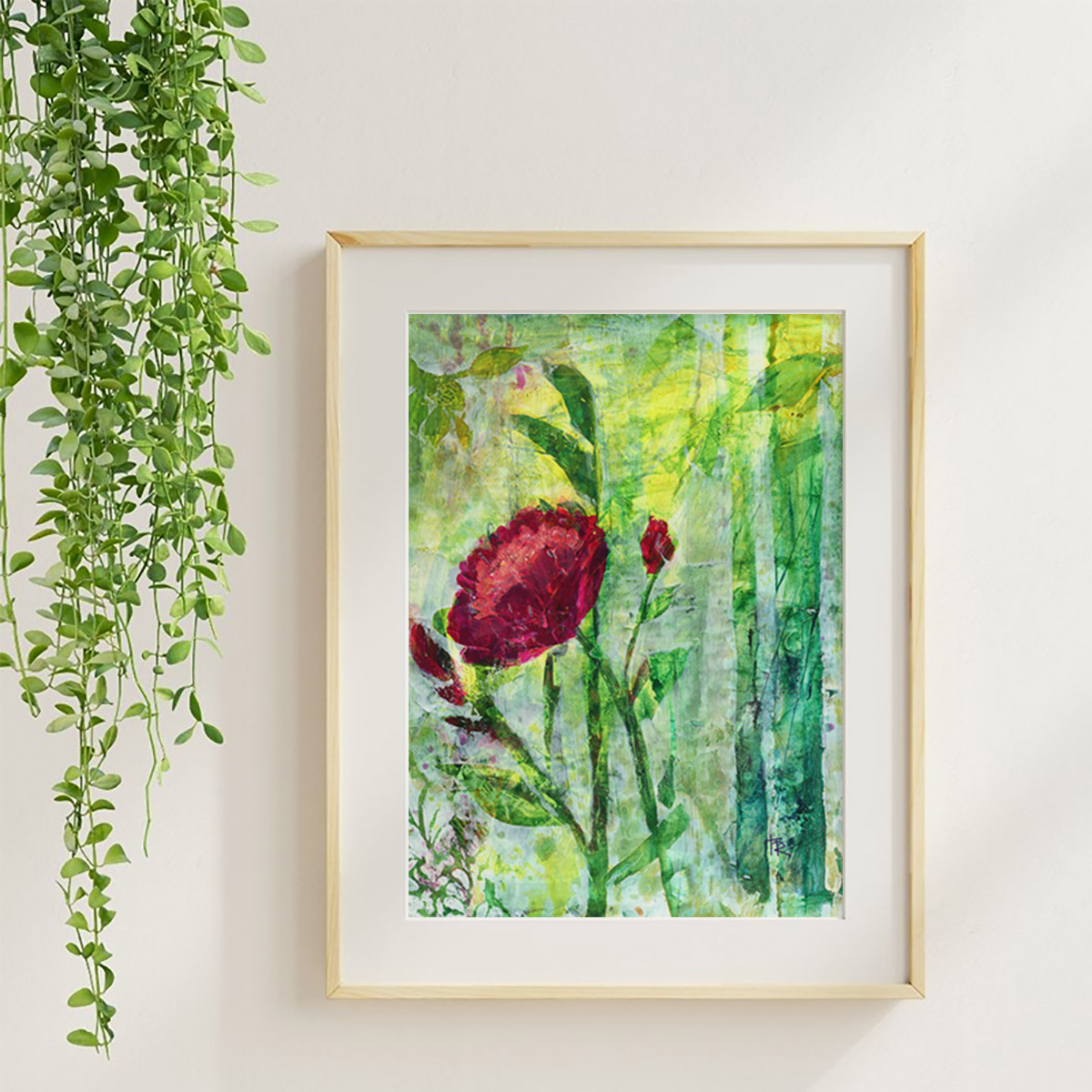 Red Radiance acrylic floral art print in a maple frame with soft neutral styling and greenery.
