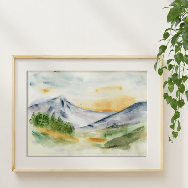 Framed watercolor mountain sunset art print showing soft sunset colors and atmospheric landscape details.