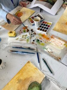 Artist preparing a lesson for a watercolor newsletter.
